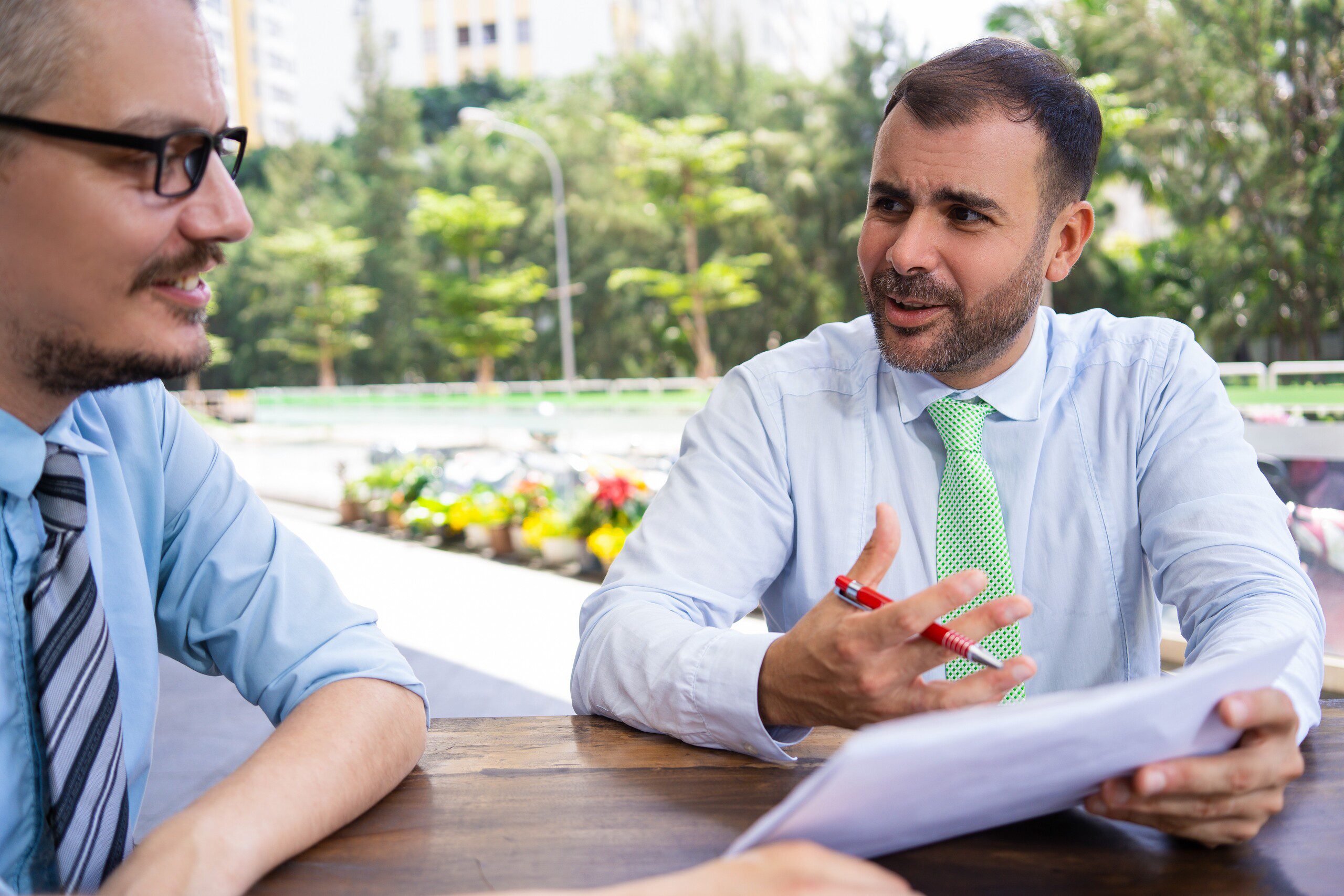 two men in a meeting about business plans and integration  